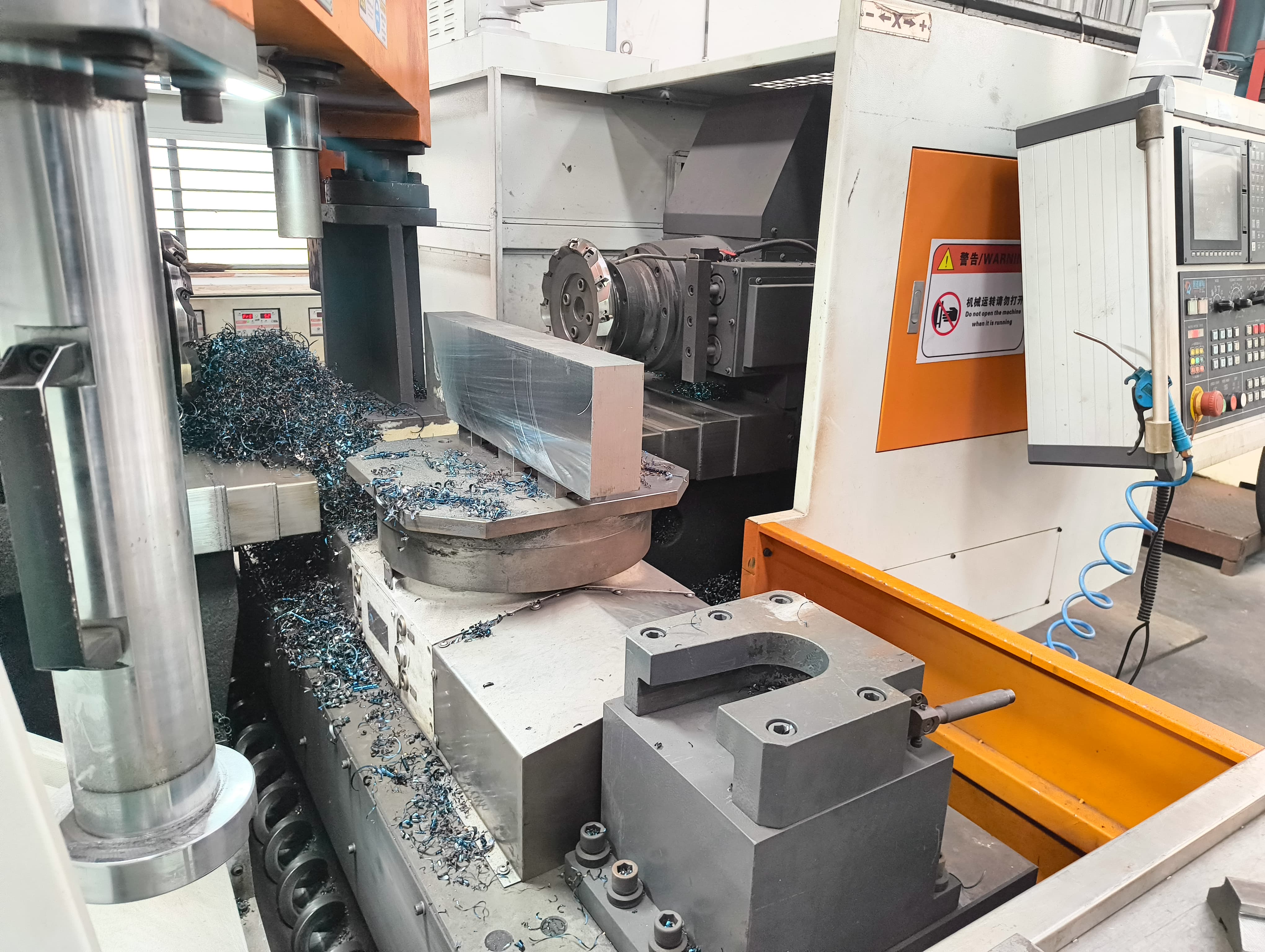 Vertical milling machine in operation
